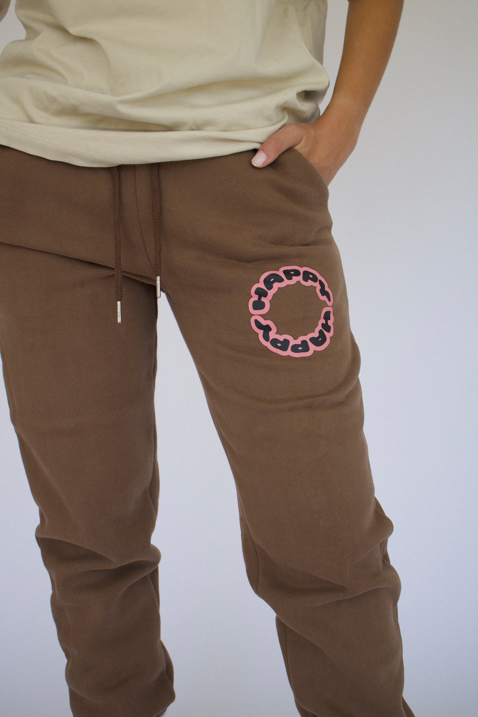 Happy Home centerpiece sweatpants chocolate lifestyle — brand that turns pain into purpose