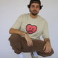 Happy Home centerpiece tee sand lifestyle — streetwear brand that supports NAMI