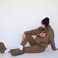 model wearing Happy Home chocolate sweat set — designed in los angeles