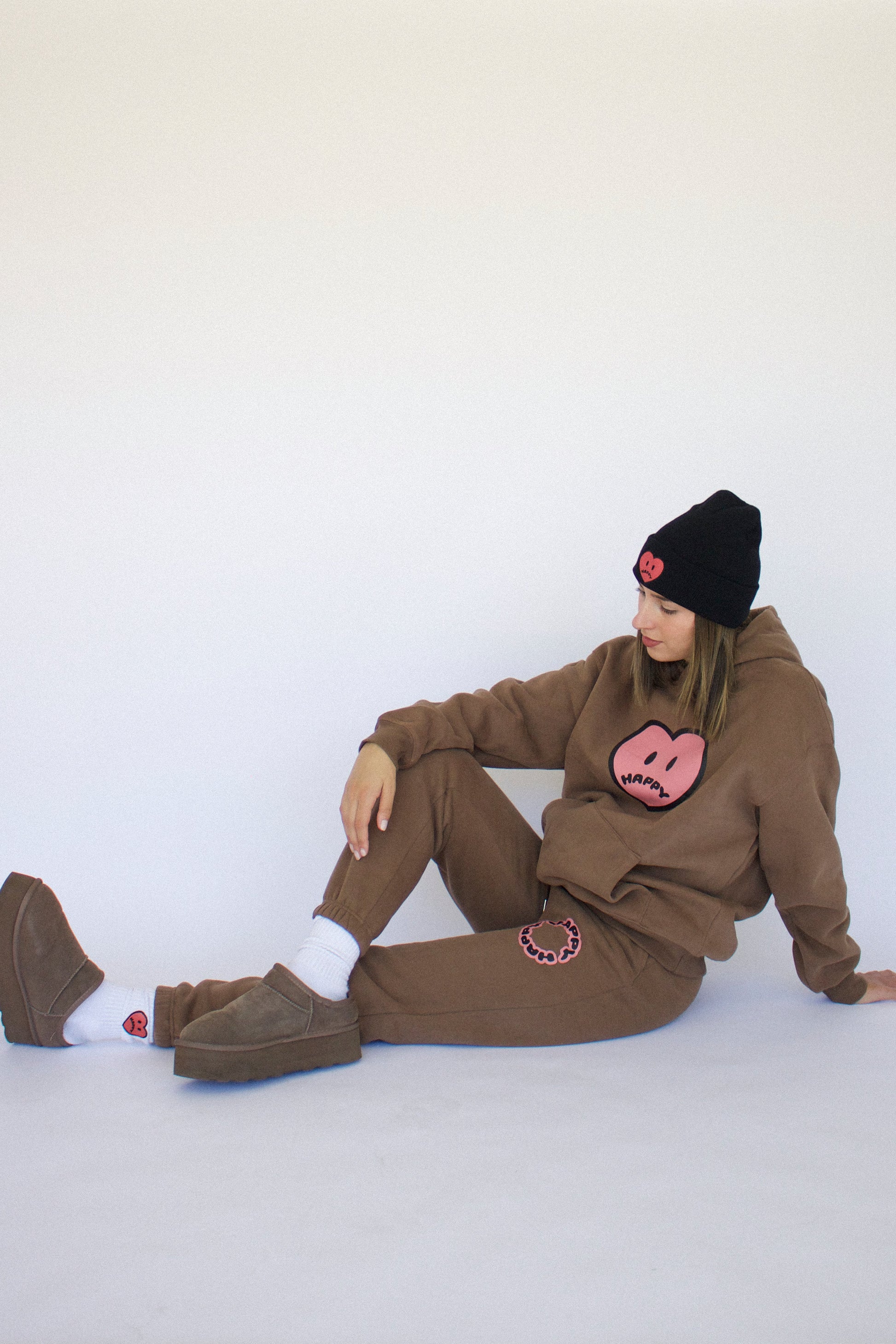 model wearing Happy Home chocolate sweat set — designed in los angeles