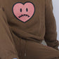 Happy Home chocolate hoodie on model — limited 240-piece drop earthy colorway