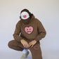 Model wearing Happy Home chocolate hoodie — mental health streetwear brand supports NAMI