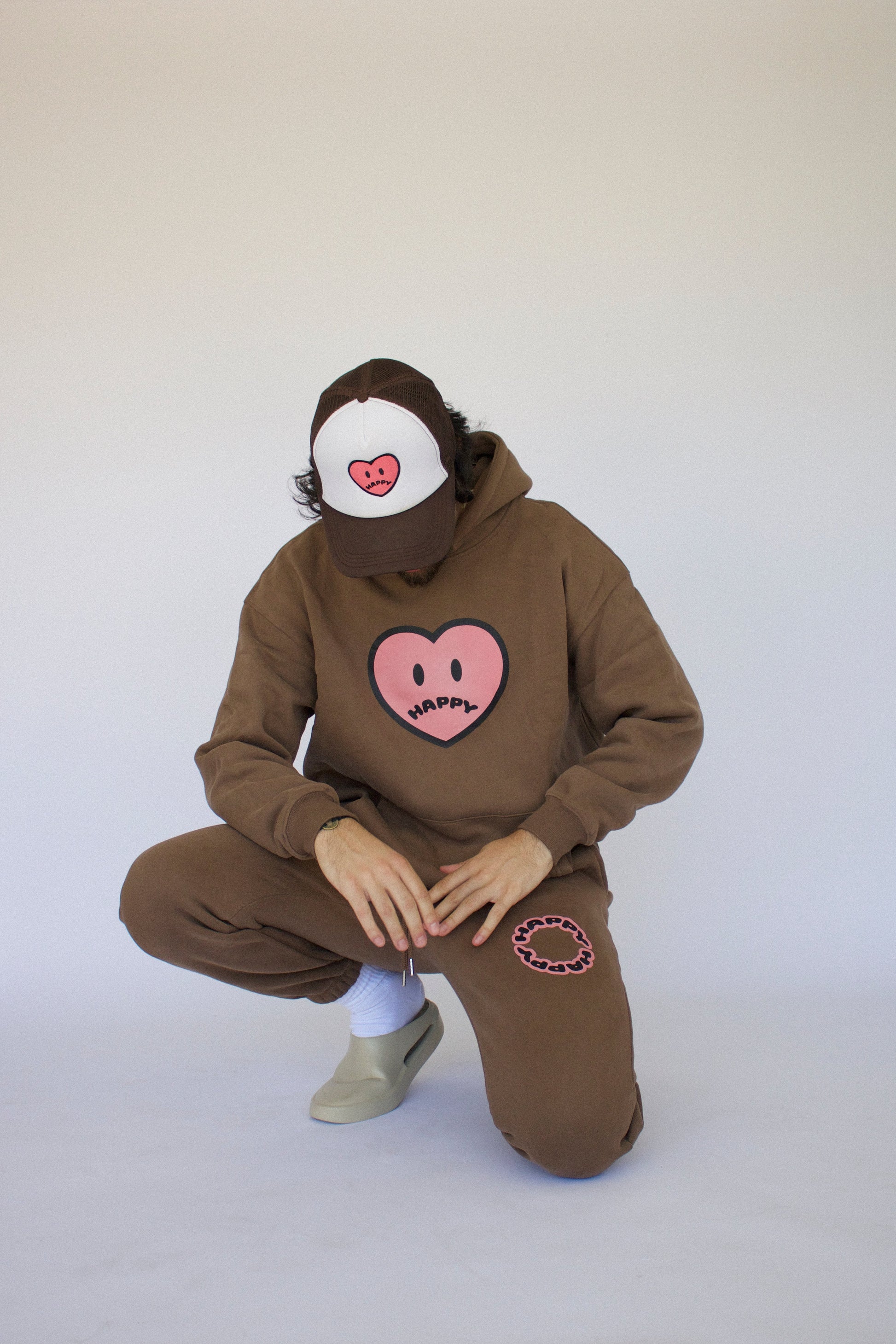 Model wearing Happy Home chocolate hoodie — mental health streetwear brand supports NAMI