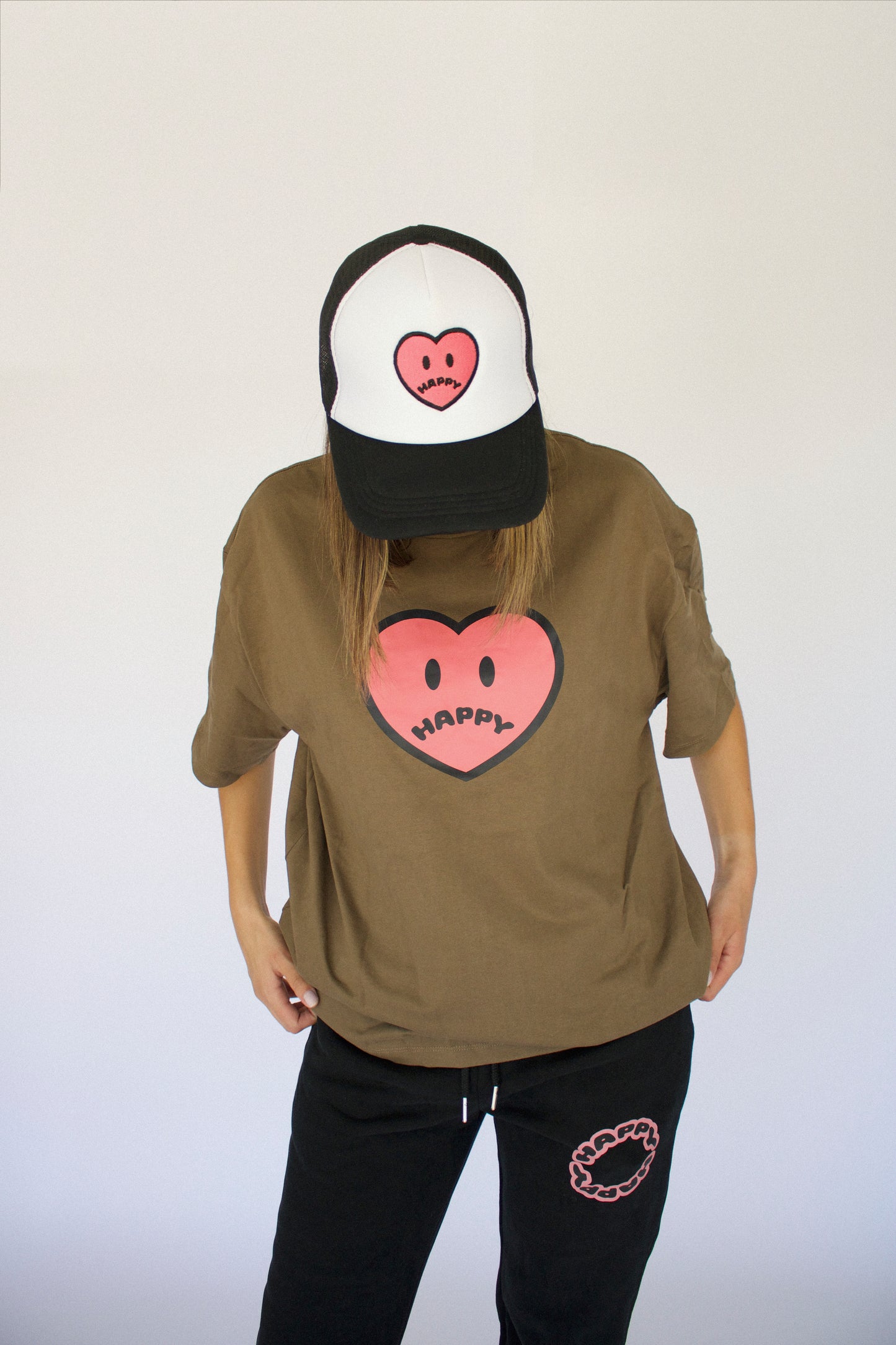 Model wearing Happy Home wood tee — founder-owned streetwear with earthy color palette