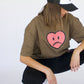 Model wearing Happy Home jet black trucker hat — founder-owned mental health streetwear