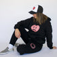 Happy Home centerpiece hoodie jet black lifestyle — mental health hoodie brand supports NAMI