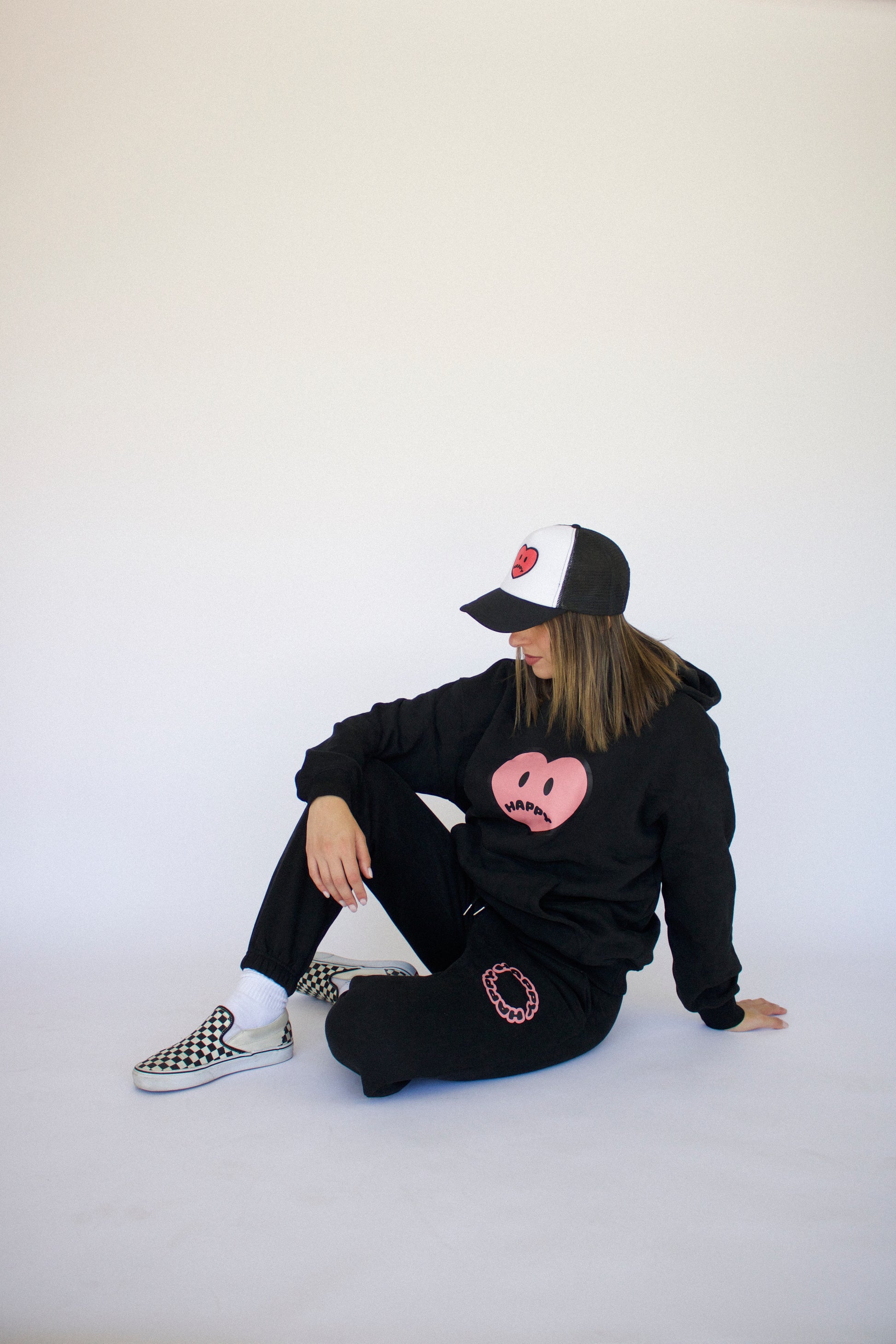 Model wearing Happy Home jet black sweatpants — founder-owned streetwear supports NAMI