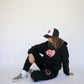 Happy Home centerpiece sweat set jet black lifestyle — matching streetwear set with a cause