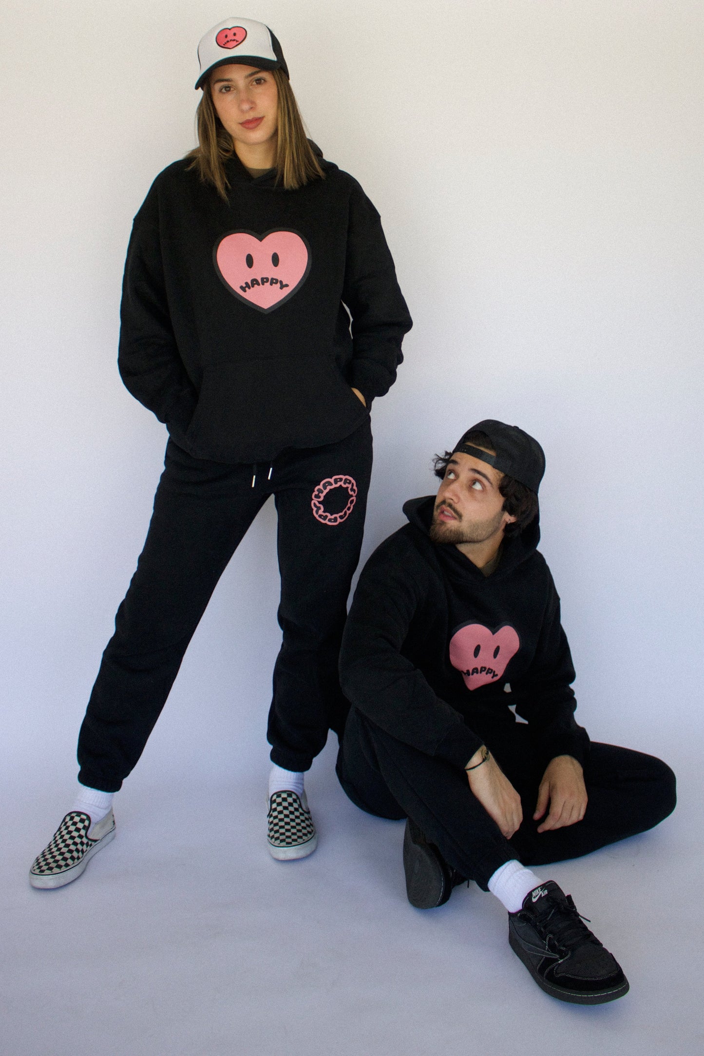Model wearing Happy Home jet black hoodie — limited 240-piece drop streetwear brand