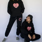 Happy Home jet black sweat set on model — limited 240-piece drop no restock