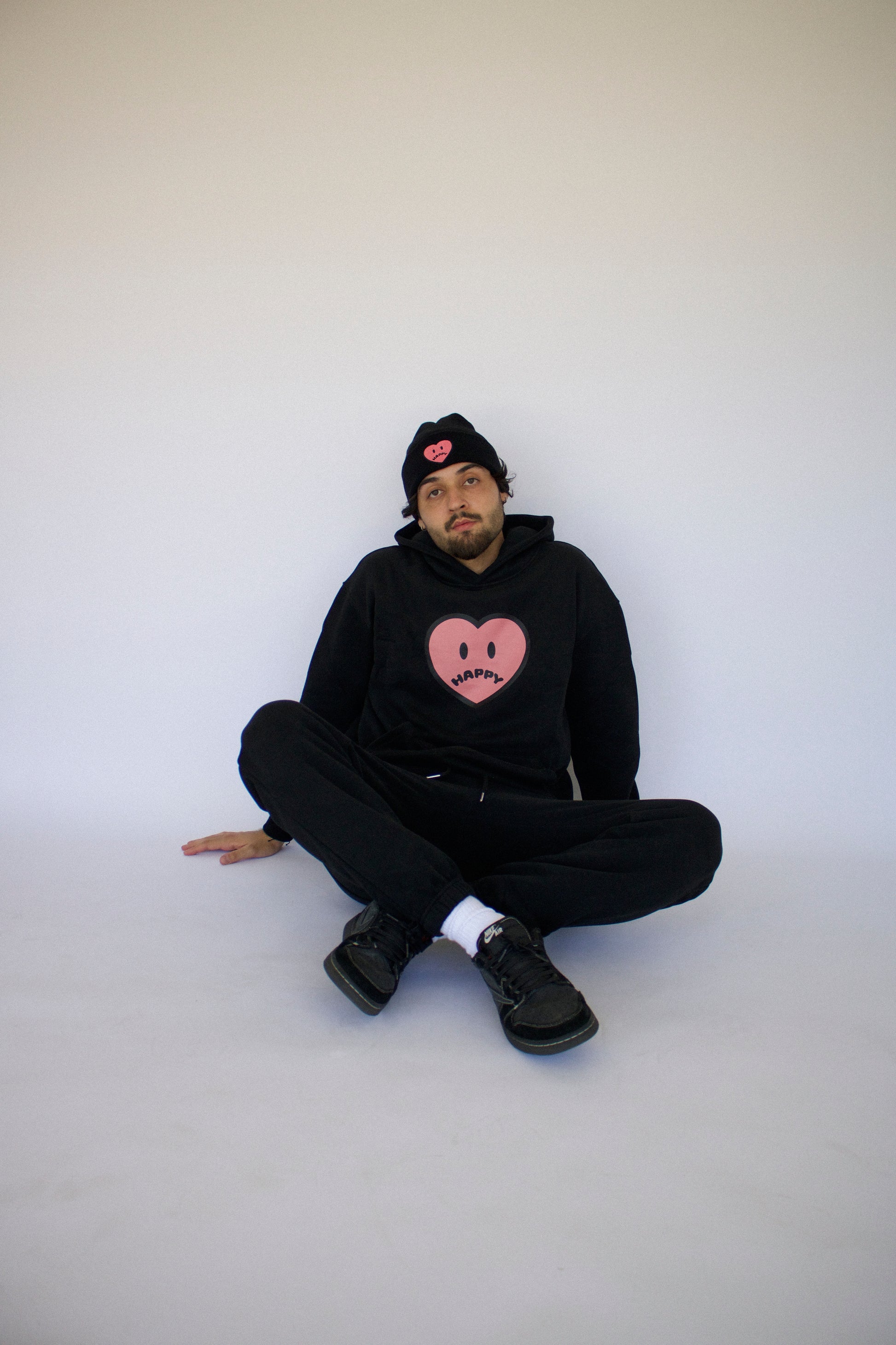 Model wearing Happy Home jet black sweat set — founder-owned streetwear brand supports NAMI
