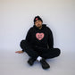 Happy Home jet black hoodie on model — founder-owned mental health streetwear supports NAMI