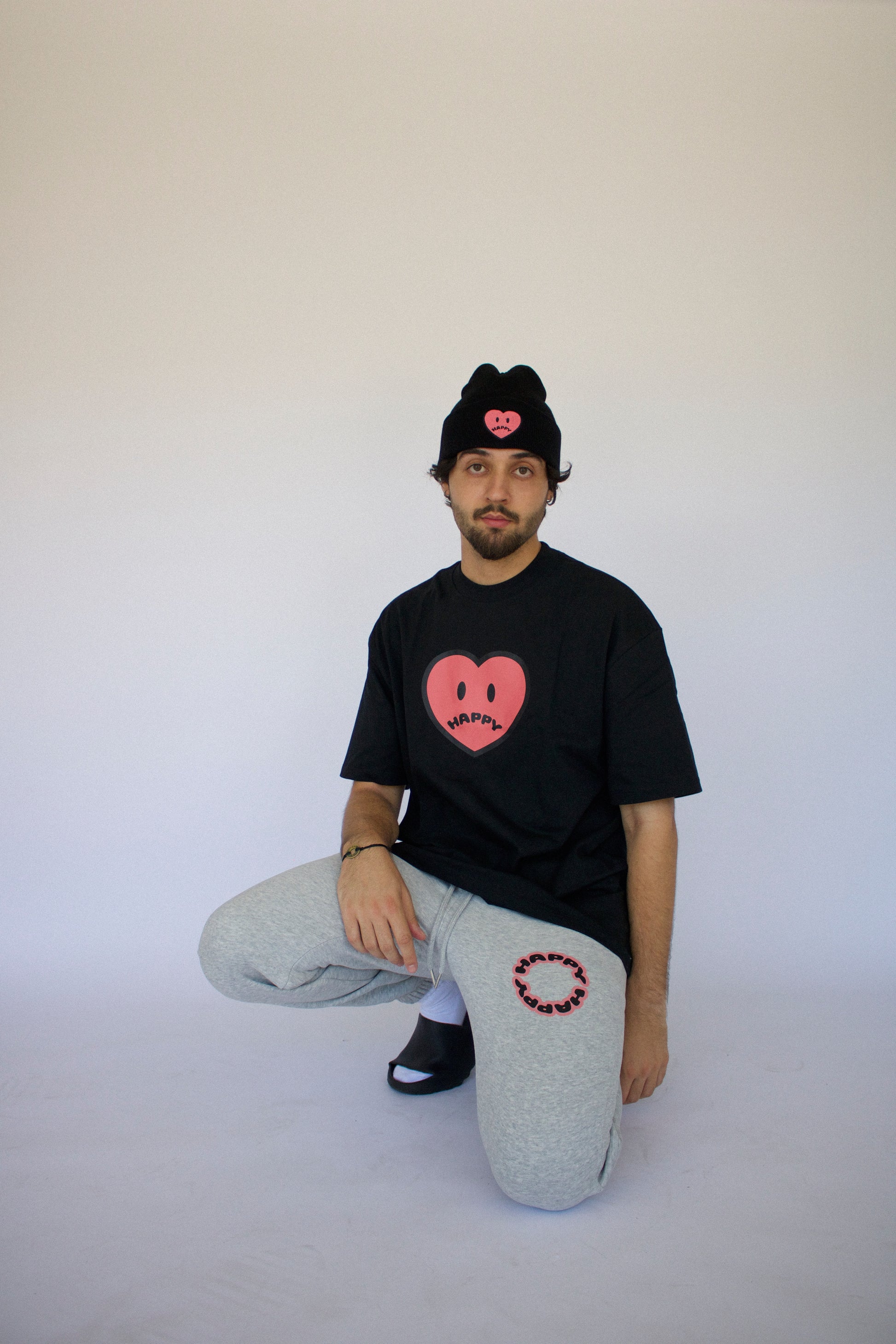 Happy Home heather gray sweatpants on model — limited drop mental health streetwear