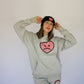 Model wearing Happy Home heather gray hoodie — founder-owned streetwear brand supports NAMI