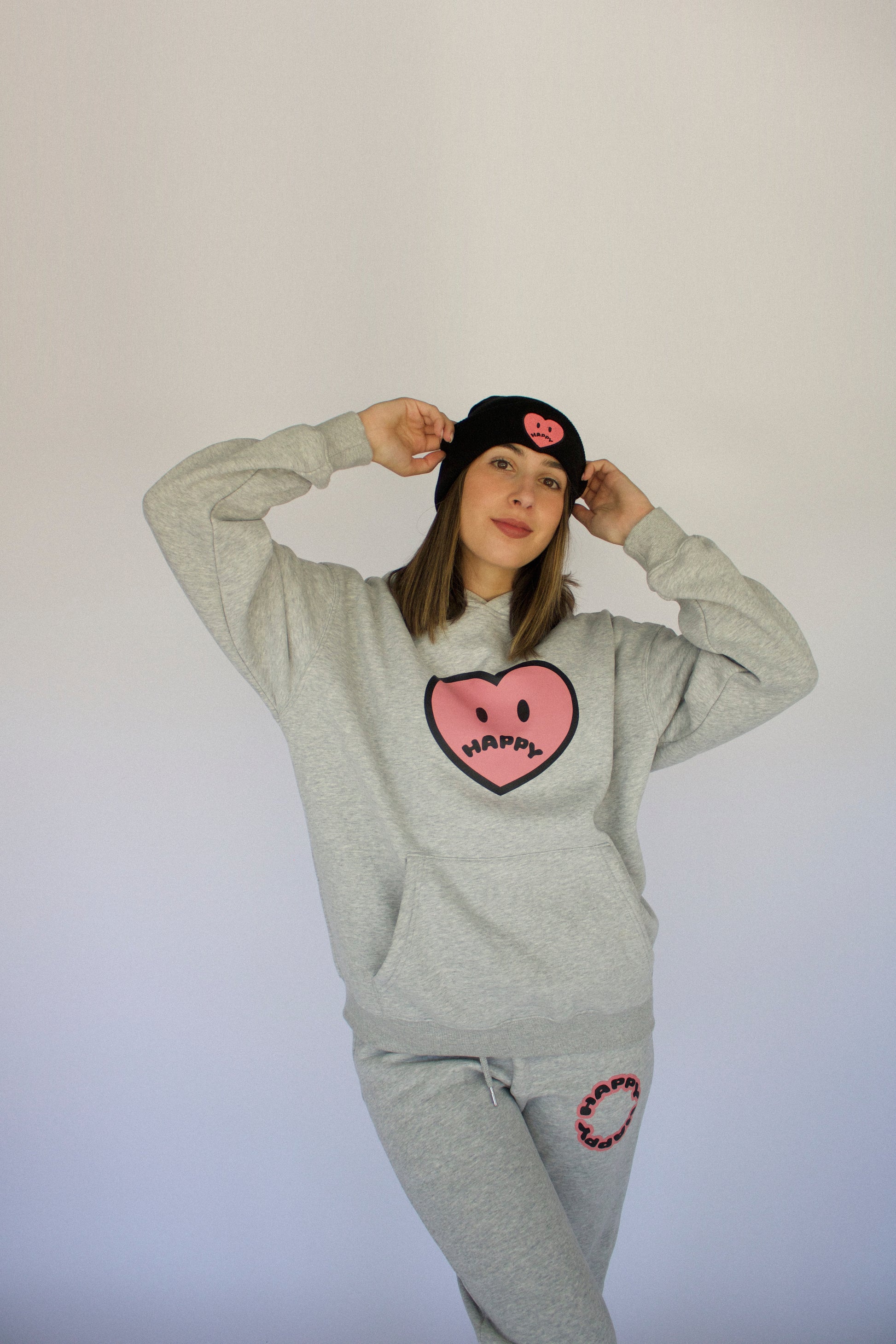 Model wearing Happy Home heather gray hoodie — founder-owned streetwear brand supports NAMI