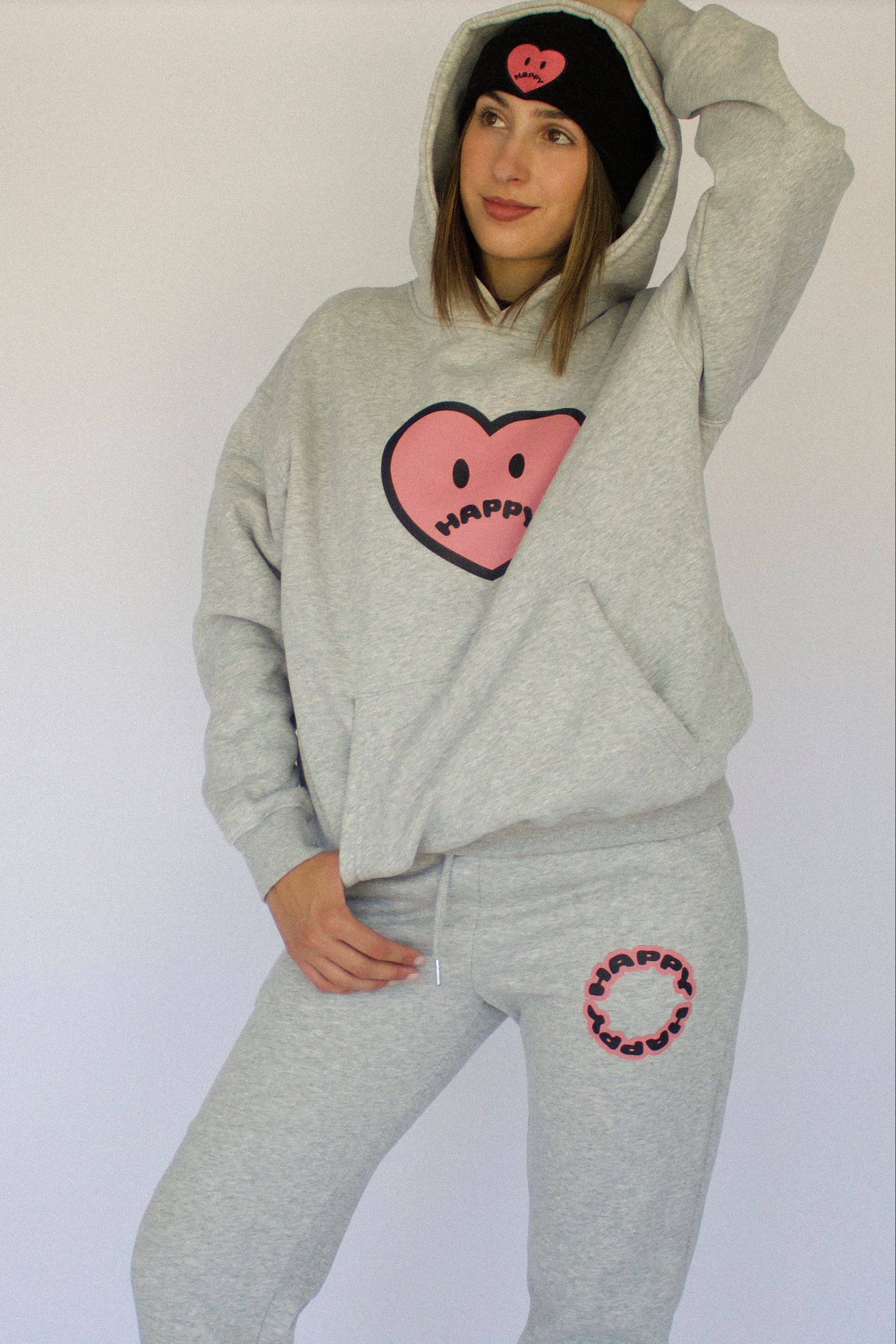 Model wearing Happy Home heather gray sweatpants — founder-owned streetwear supports NAMI