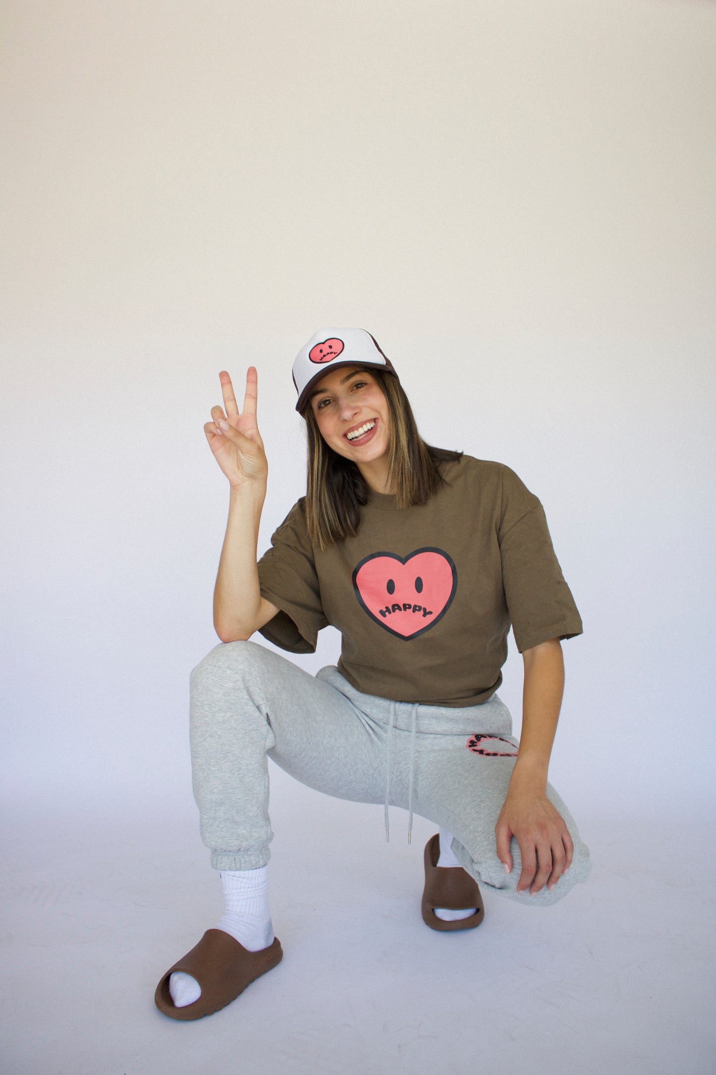 Happy Home centerpiece tee wood lifestyle — brand that turns pain into purpose