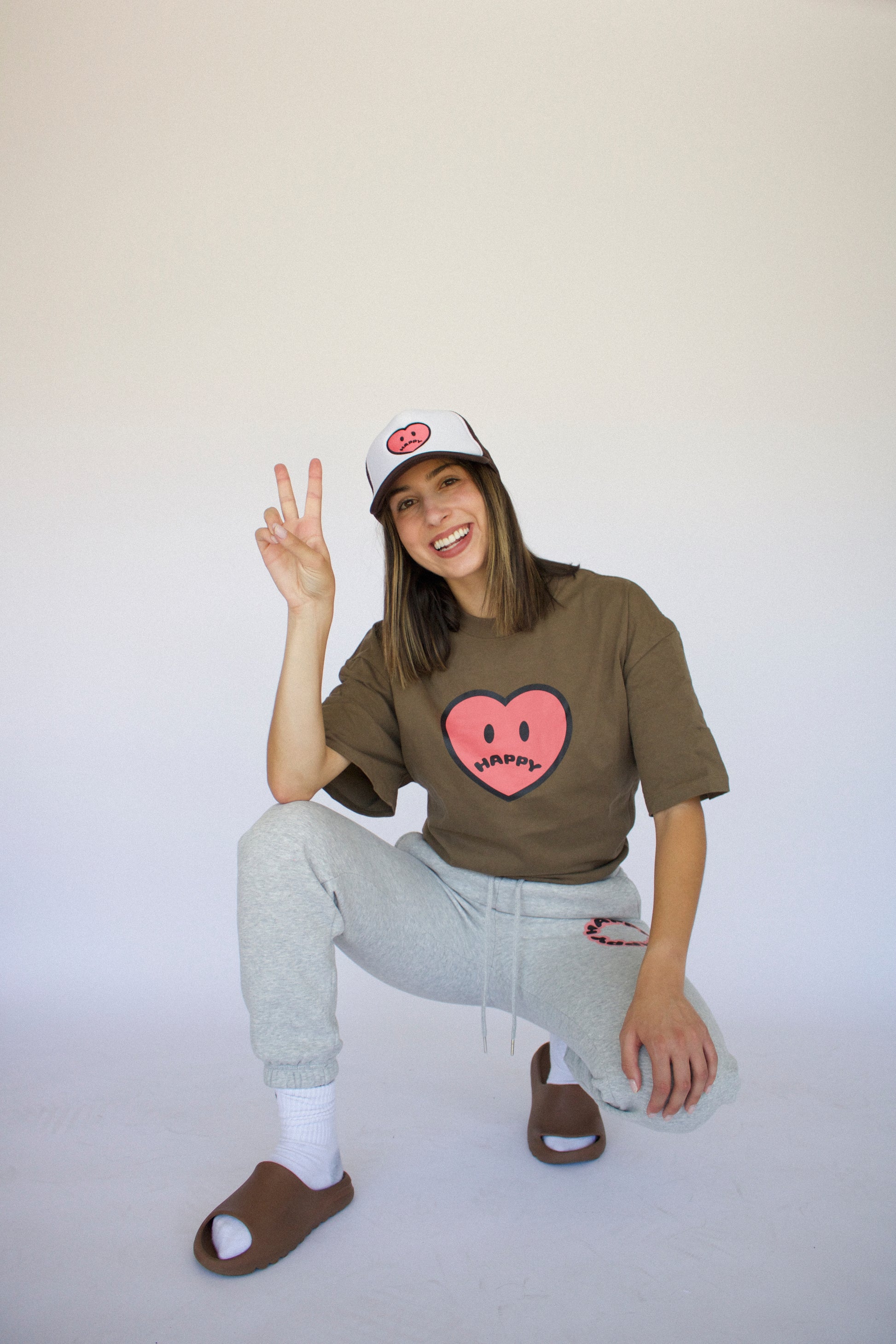 Happy Home centerpiece tee wood lifestyle — brand that turns pain into purpose