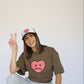 Happy Home centerpiece trucker hat chocolate lifestyle — earthy streetwear brand with a cause