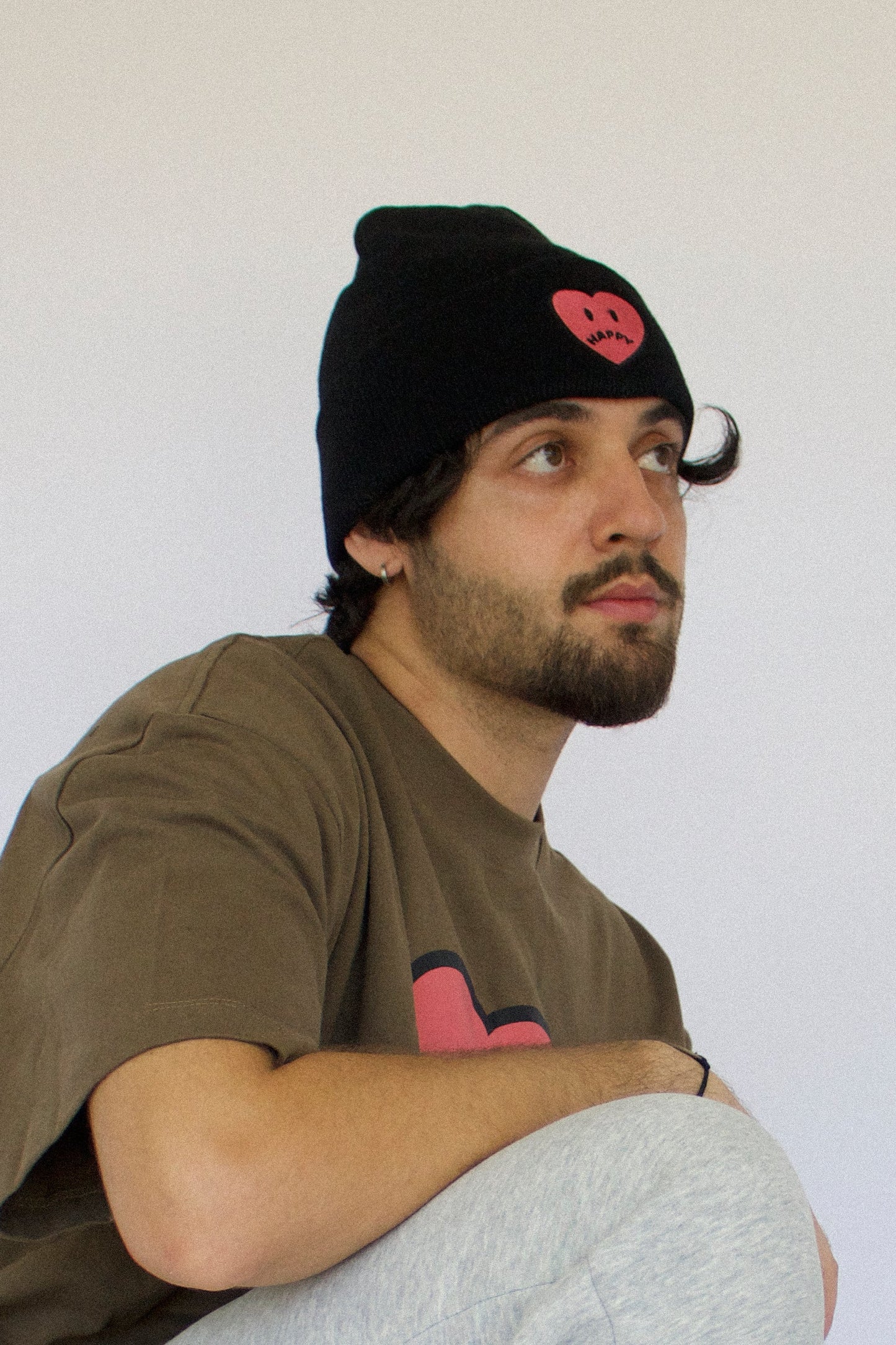 Happy Home beanie lifestyle photo — limited drop streetwear accessory