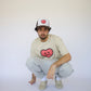 Model wearing Happy Home sand tee — founder-owned minimal streetwear brand