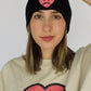Happy Home centerpiece beanie on model — founder-owned clothing brand supports NAMI