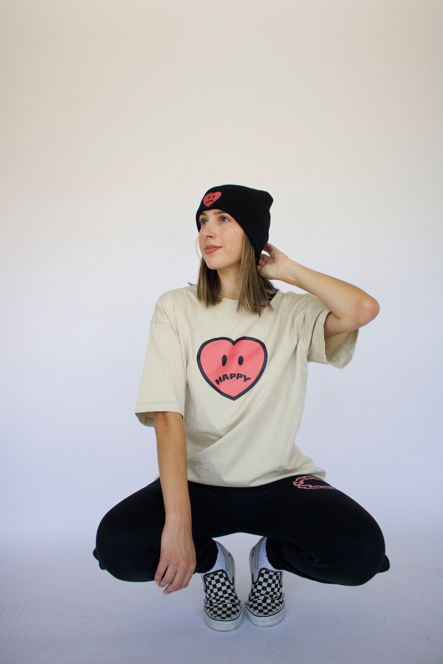 Happy Home sand tee on model — limited drop earthy colorway streetwear