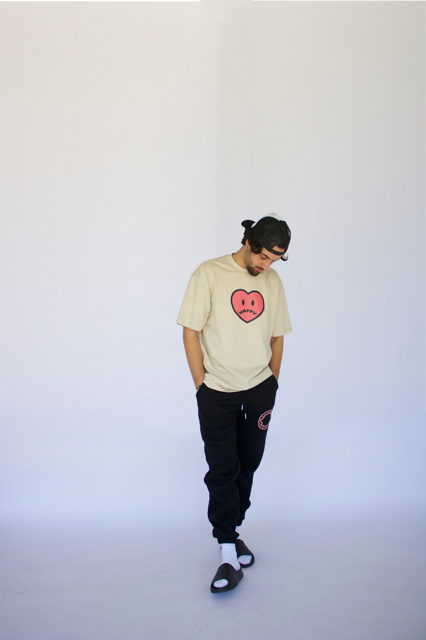 Happy Home jet black sweatpants on model — limited drop no restock streetwear