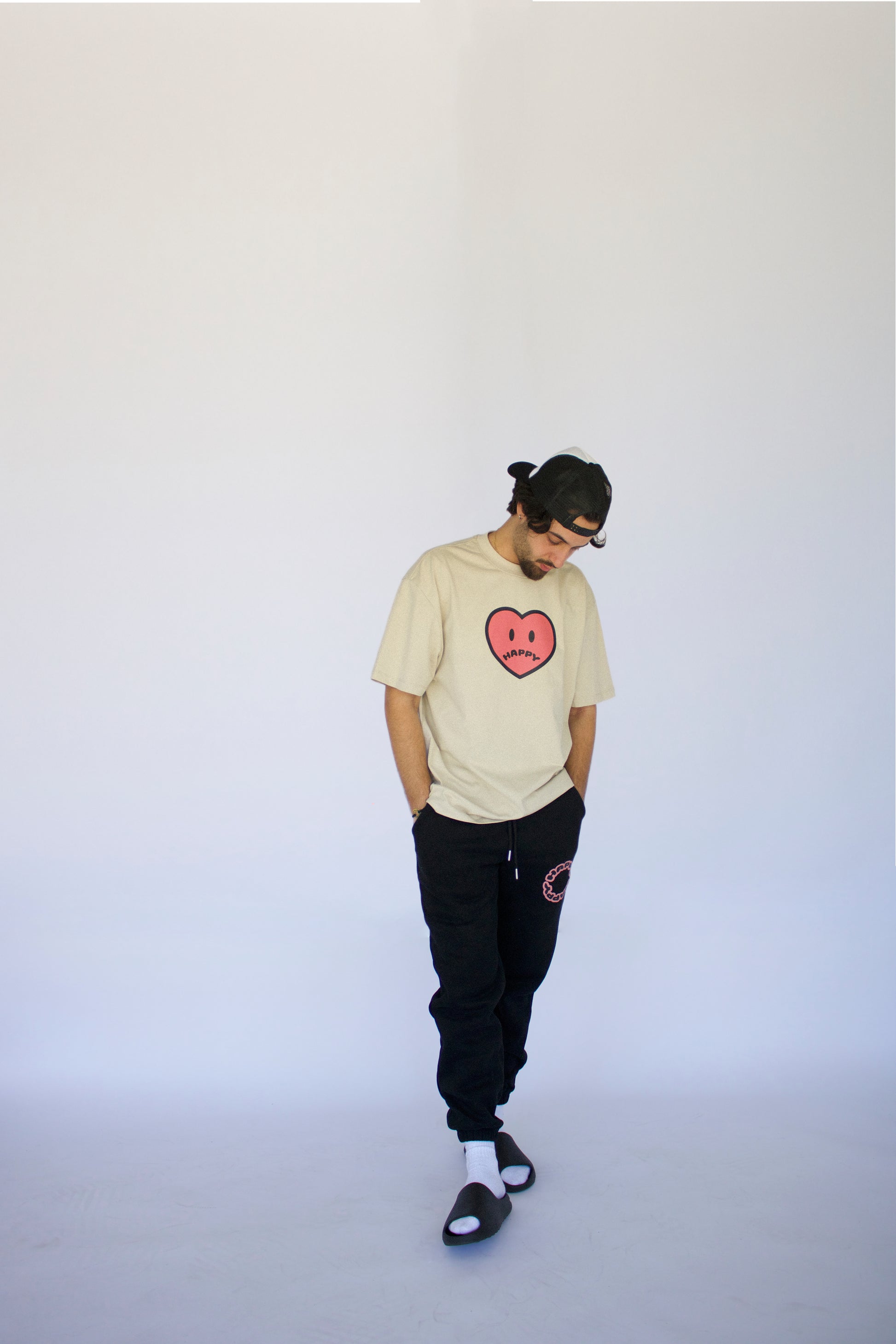 Happy Home jet black sweatpants on model — limited drop no restock streetwear