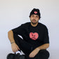 Model wearing Happy Home jet black tee — founder-owned streetwear brand supports NAMI