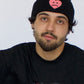 Model wearing Happy Home centerpiece beanie — streetwear brand that supports NAMI