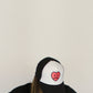 Happy Home centerpiece trucker hat jet black lifestyle — streetwear brand that supports NAMI