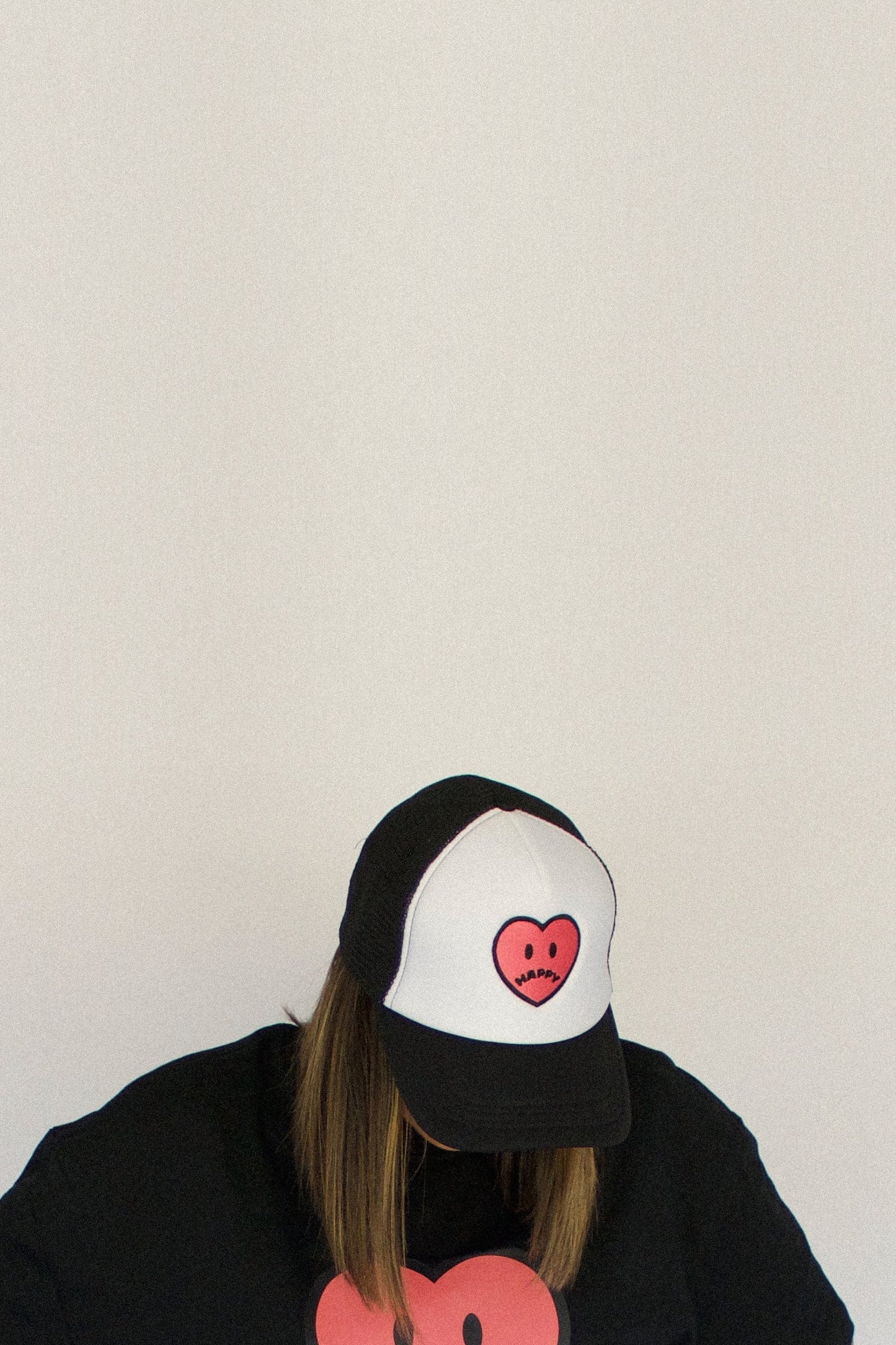 Happy Home centerpiece trucker hat jet black lifestyle — streetwear brand that supports NAMI