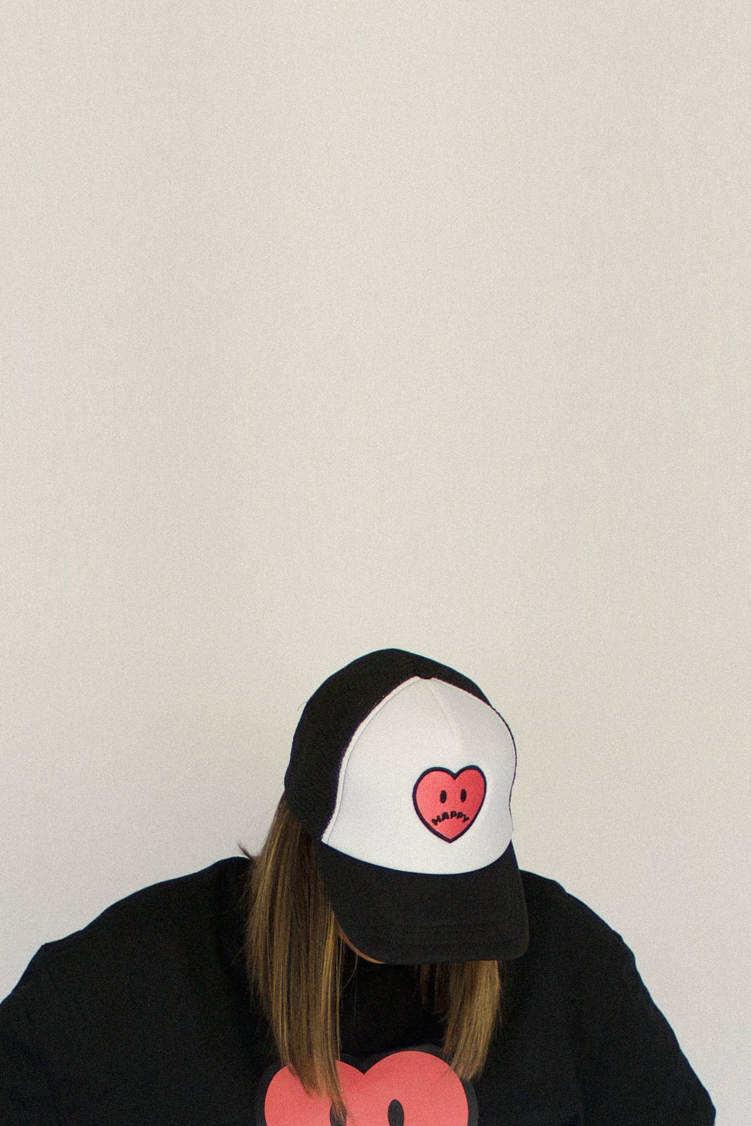 Happy Home centerpiece trucker hat jet black lifestyle — streetwear brand that supports NAMI