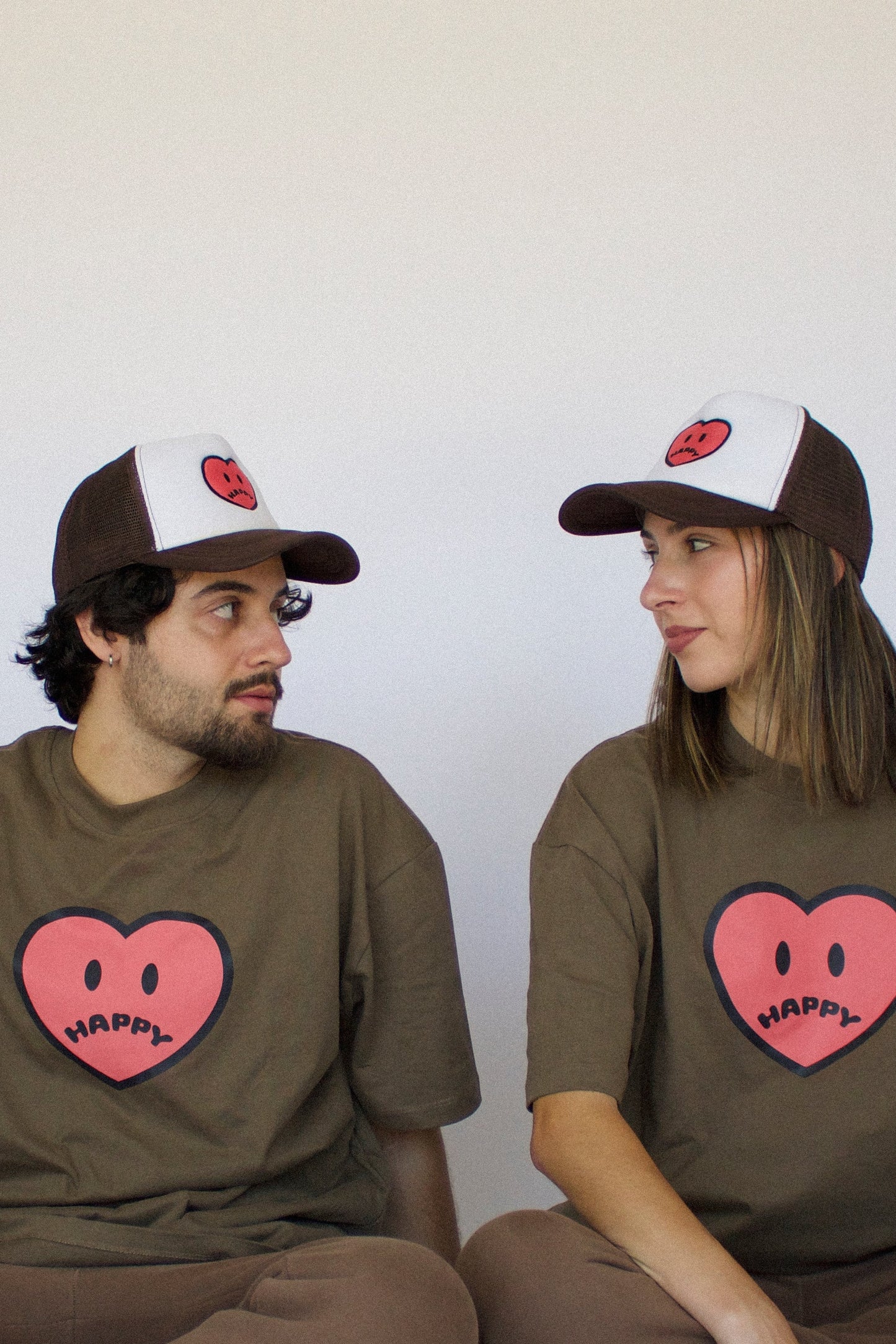 Happy Home chocolate trucker hat on model — limited drop streetwear accessory