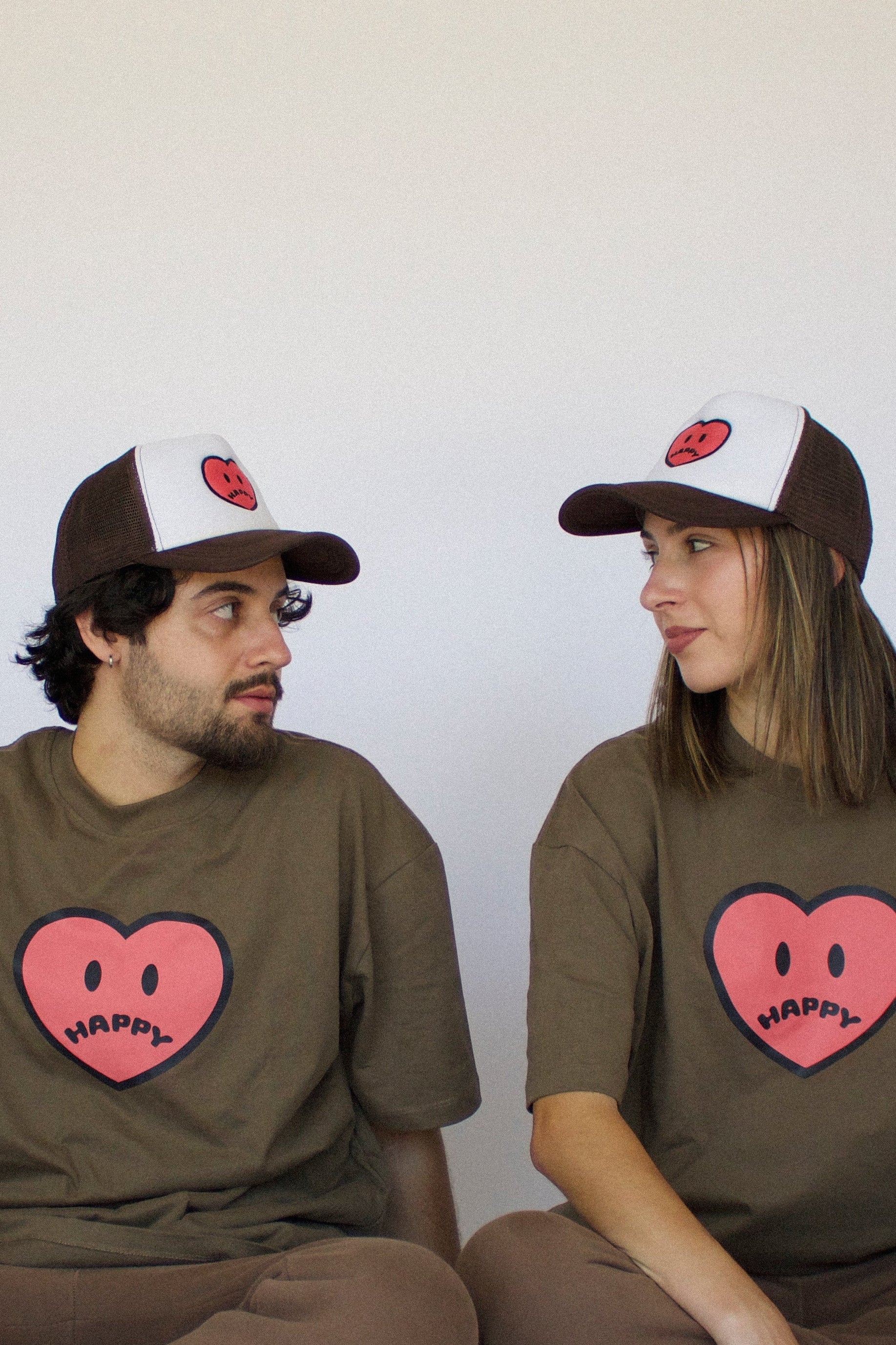 Happy Home chocolate trucker hat on model — limited drop streetwear accessory