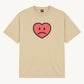 Happy Home centerpiece tee sand front — screen-printed HAPPY logo, 240 GSM 100% cotton