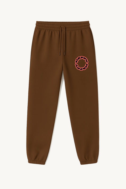 Happy Home centerpiece sweatpants chocolate front — globe HAPPY logo, 340 GSM fleece